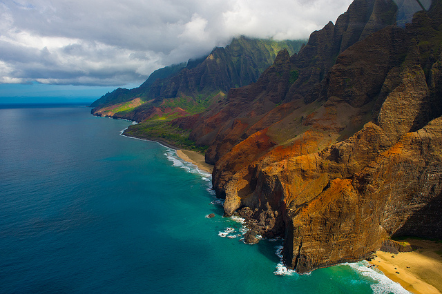 This fifteen-mile stretch of coastline is located on the northwest shore of Kauai. Much of Na Pali Coast is inaccessible due to its characteristic sheer cliffs that drop straight down into the ocean. This shot taken from a helicopter.